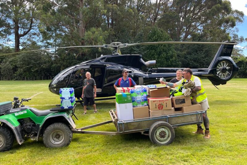 Trailer full of gear being loaded into helicopter