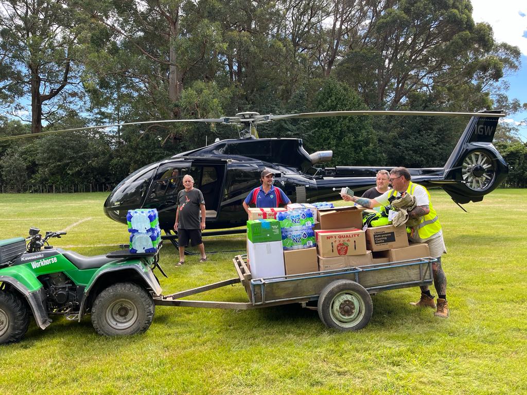 Trailer full of gear being loaded into helicopter